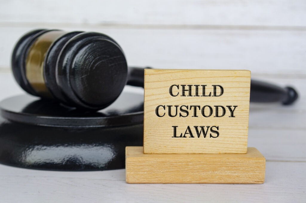 Child custody laws gavel and wooden block with text 